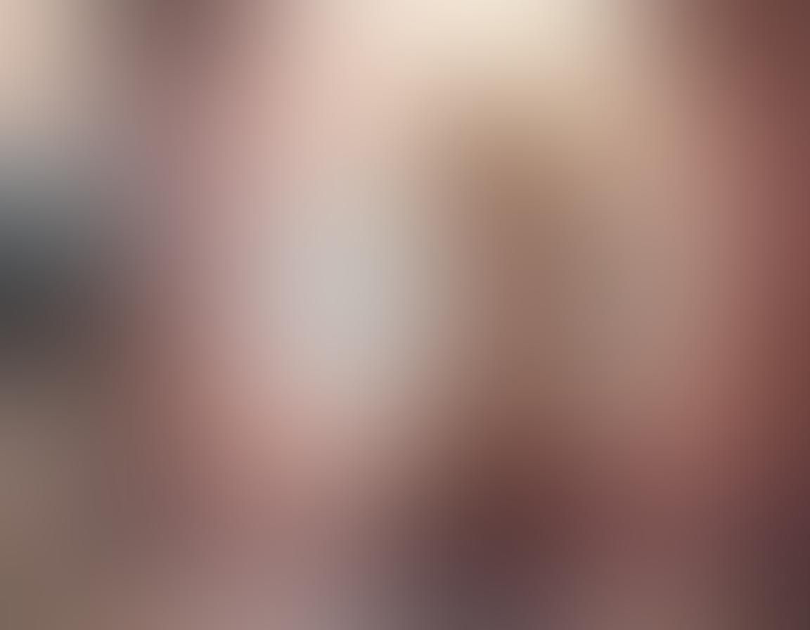 A dreamy and alluring scene featuring a model draped in sensual lingerie surrounded by soft, flowing fabrics and ethereal lighting. In the background, a serene beach setting with hints of vibrant swimwear peeking through, embodying romance and fantasy. Delicate floral motifs and luxurious textures enhance the atmosphere. The color palette should be soft pastels with pops of deep jewel tones. super-realistic. vibrant colors. soft focus.